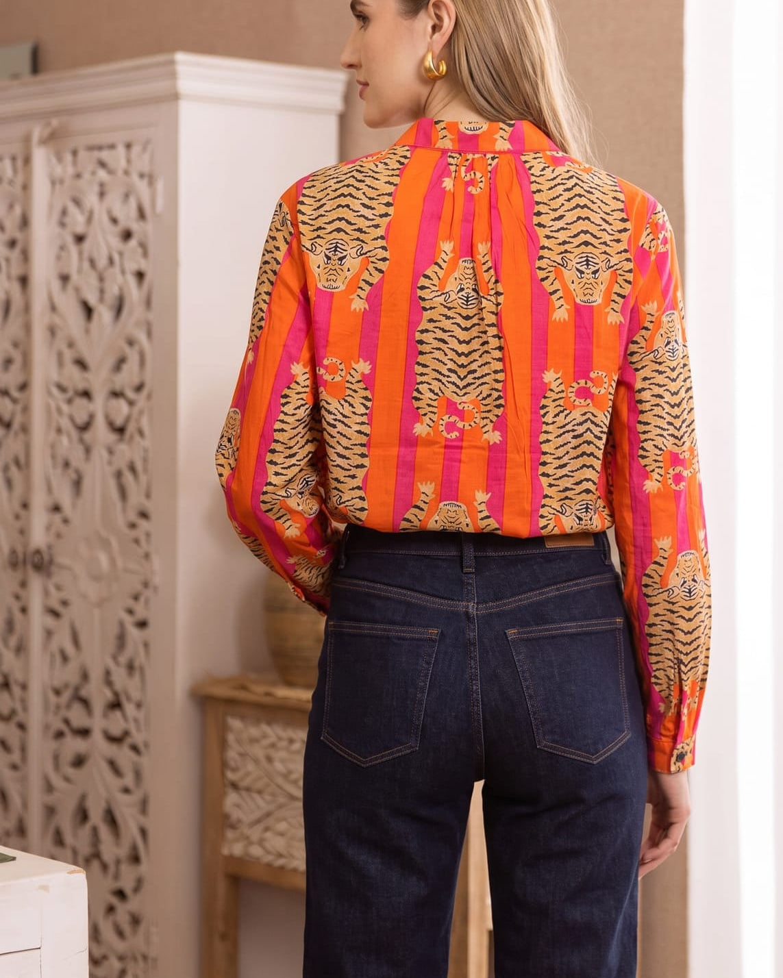 Back view of the Tibetan Tiger Blouse showing the yoke, box pleat, and tiger-stripe print continuing across the back and sleeves
