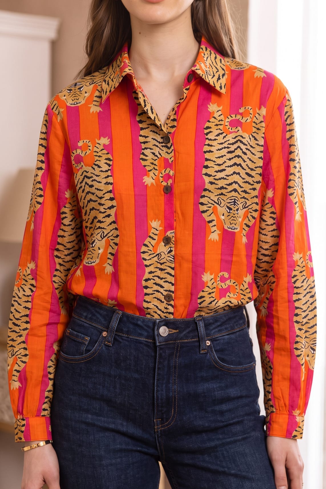 Close-up front view of the Tibetan Tiger Blouse showing the pointed collar, button placket, and tiger-and-stripe print detail in orange, pink, and black